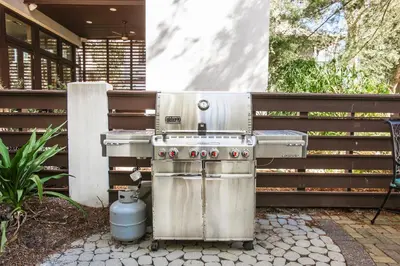 a stainless steel barbecue grill sitting on a patio at Benoit Cottage in Rosemary Beach