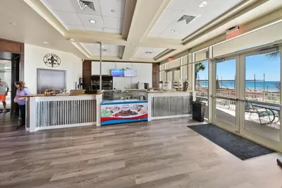 a restaurant with a view of the beach at Aqua 408 in Panama City Beach