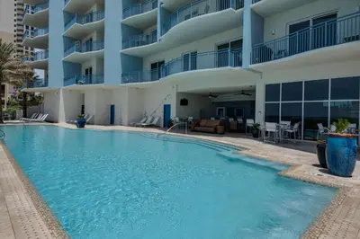 a swimming pool in front of a building at Sterling Breeze 1903 in Panama City Beach