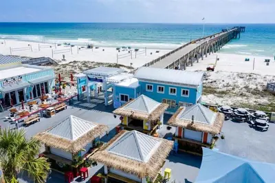 an aerial view of a beach with a pier at Aqua 1003 in Panama City Beach