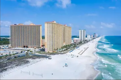 an aerial view of a beach with buildings and the ocean at Calypso 208 East Direct Gulf Front Exceptional in Panama City Beach