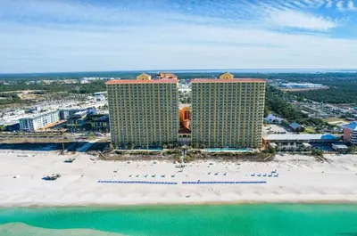 an aerial view of a resort with a beach and buildings at Calypso 208 East Direct Gulf Front Exceptional in Panama City Beach