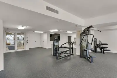 a gym with treadmills and ellipticals in a room at Calypso 209W Incredible Corner unit Best view in PCB in Panama City Beach