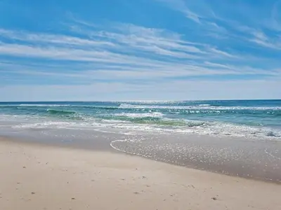 a sandy beach with the ocean in the background at Calypso 209W Incredible Corner unit Best view in PCB in Panama City Beach