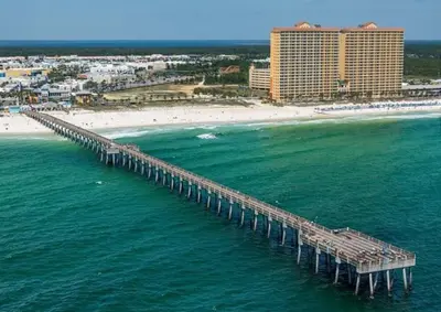 an aerial view of a pier over the ocean with a beach at 2206E Calypso Direct Gulffront Brand new remodel in Panama City Beach