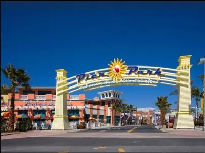 a large entrance to a resort with a sign at Grand Panama 407 in Panama City Beach