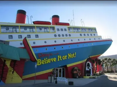 a large cruise ship parked next to a building at Grand Panama 902 in Panama City Beach