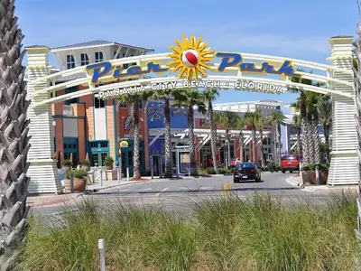 a large entrance to a amusement park with a sign at Sterling Breeze 202 in Panama City Beach
