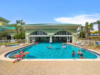 a group of people swimming in a swimming pool at Celadon #0808 in Panama City Beach