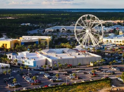 an aerial view of a city with a ferris wheel at Calypso 402E by Warren Beach Rentals in Panama City Beach
