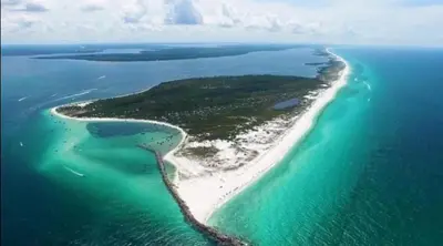 an aerial view of an island in the ocean at Grand Panama 1101 in Panama City Beach