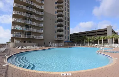 a large swimming pool in front of a building at Tidewater 0509 in Panama City Beach