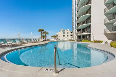 a swimming pool in front of a building at Watercrest 209 White-Sands Getaway - Sleeps 8 in Panama City Beach