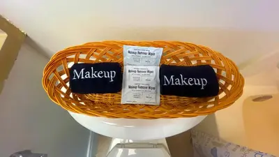a wicker basket with makeup products on a shelf at Sunbird Resort 10th Floor Amazing Sunsets - by Sunbird Rentals in Panama City Beach