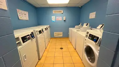 a laundry room with washers and dryers in it at Sunbird Resort 5th Floor Amazing View! - by Sunbird Rentals in Panama City Beach