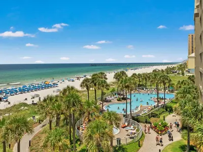 a view of the beach from the balcony of a resort at Grand Panama by Panhandle Getaways in Panama City Beach