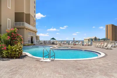 a swimming pool in the middle of a building at Grand Panama by Panhandle Getaways in Panama City Beach