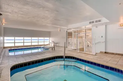 a swimming pool in the middle of a house at Tidewater Beach Resort by Panhandle Getaways in Panama City Beach