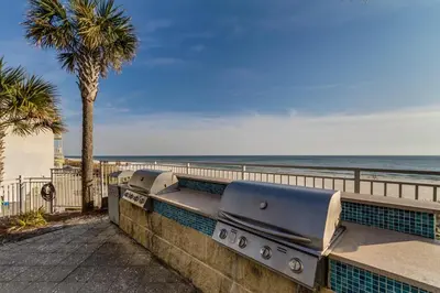a retaining wall with a view of the beach at Aqua 0411 in Panama City Beach
