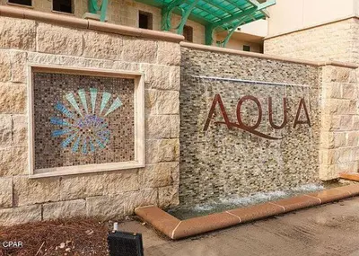 aania sign on the side of a building at Aqua 2308 in Panama City Beach