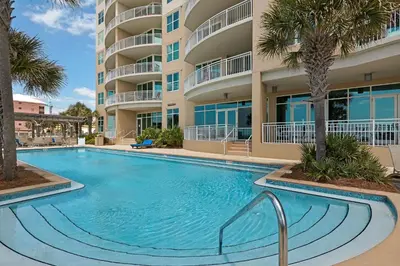 a large swimming pool in front of a building at Aqua 0208 in Panama City Beach
