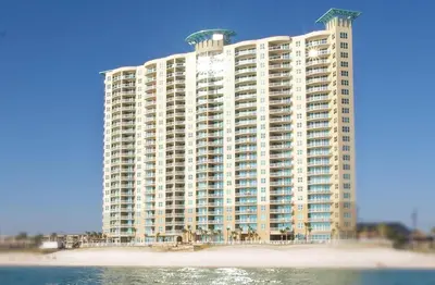 a large building on the beach next to the water at Aqua 1008 in Panama City Beach
