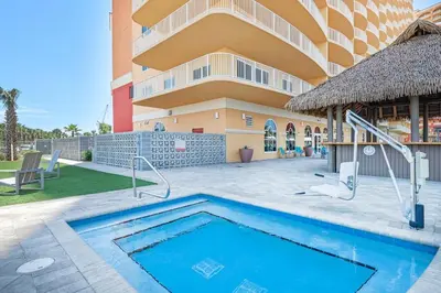 a swimming pool in front of a building at Calypso 3-309 - Gypsea's View in Panama City Beach