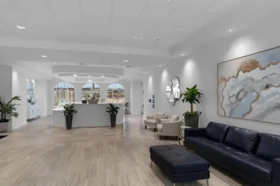 a lobby with a couch and chairs in a building at Calypso 3-309 - Gypsea's View in Panama City Beach