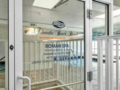 a glass door with a sign on a building at Tidewater 2903 in Panama City Beach