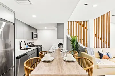 a kitchen and dining room with a table and chairs at Ocean Breeze 1C in Panama City Beach