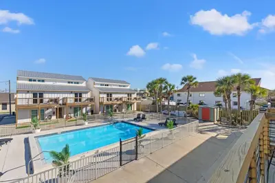 an image of a swimming pool at a resort at Ocean Breeze 2C in Panama City Beach