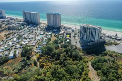 an aerial view of a parking lot next to the beach at The Yard by Beach Haven Vacation Rentals in Panama City Beach