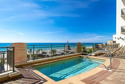 a swimming pool with a view of the ocean at Origin 1332 - One Bedroom - Pool and Gulf Views by Beach Haven Vacation Rentals in Panama City Beach