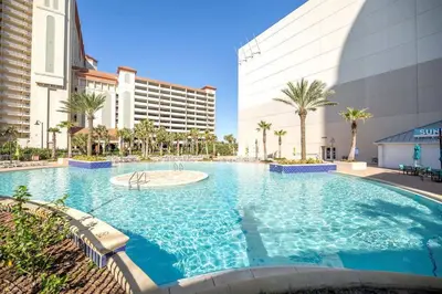 a large swimming pool in front of a building at Laketown Wharf #236 by Nautical Properties in Panama City Beach