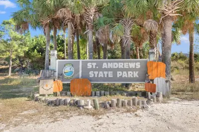 a sign for the st andrews state park at Commodore 0502 in Panama City Beach