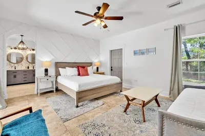 a bedroom with a bed and a ceiling fan at Saltaire-2 in Santa Rosa Beach