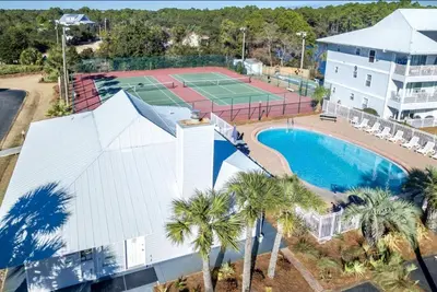 an aerial view of a tennis court and a tennis court at Beachside Villas 1131 in Santa Rosa Beach