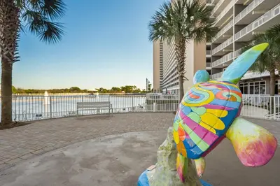 a statue of a colorful fish on a rock at Laketown Wharf #0703 in Panama City Beach