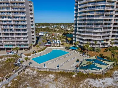 an aerial view of a pool in front of some buildings at Dunes of Panama C605 in Panama City Beach