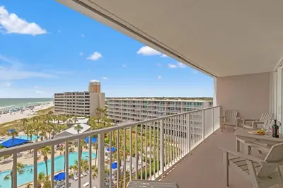 a balcony with a view of the beach and the ocean at Dunes of Panama C605 in Panama City Beach