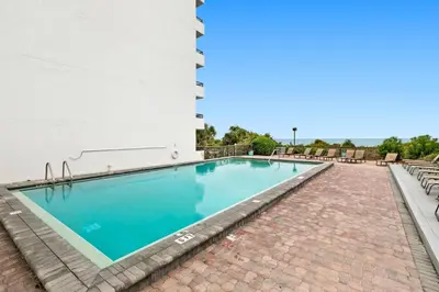 a swimming pool on the side of a building at One Seagrove Place 0204 in Santa Rosa Beach