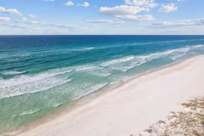 an aerial view of a beach with the ocean at Time & Tide 30A in Inlet Beach