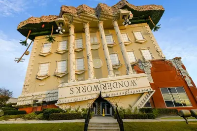 a building with a sign that reads sxswonian club onion at The Pink Flamingo by Book That Condo in Panama City Beach