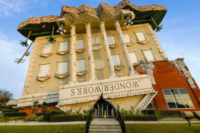 a building with a sign that reads sxswonian club onion at Shores of Panama #421 by Book That Condo in Panama City Beach