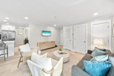 a living room with a couch and a table at Beachside Villas 811 in Watersound Beach