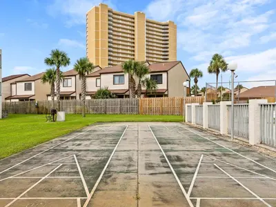 an empty basketball court in front of a building at Endless Summer #A30 in Panama City Beach