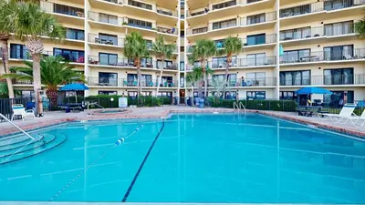 a large swimming pool in front of a building at Commodore 0607 in Panama City Beach