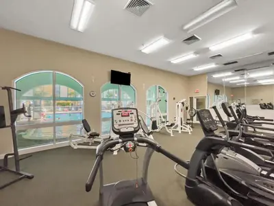 a gym with several treadmills and cardio machines at Celadon #0606 in Panama City Beach
