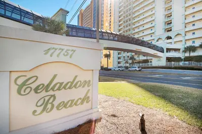 a sign for a hotel with a bridge over a street at Celadon 405 by Emerald Coast Retreats in Panama City Beach
