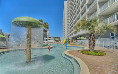 a swimming pool with a fountain in the middle of a building at Spacious 3BR + Bunk Laketown Wharf Condo Sleeping 10 Near Beach in Panama City Beach